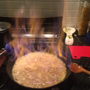 Chicken livers being flambéd with brandy